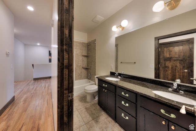 284 W Mcgill Blvd, Moab, UT 84532 - bathroom with toilet, double vanity, a sink, and shower / bathing tub combination