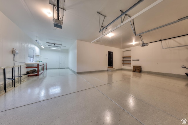284 W Mcgill Blvd, Moab, UT 84532 - garage with baseboards and a garage door opener