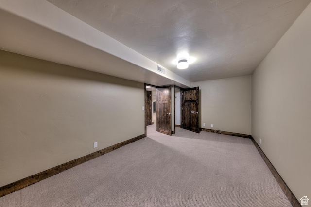 284 W Mcgill Blvd, Moab, UT 84532 - finished below grade area featuring visible vents, baseboards, and carpet floors
