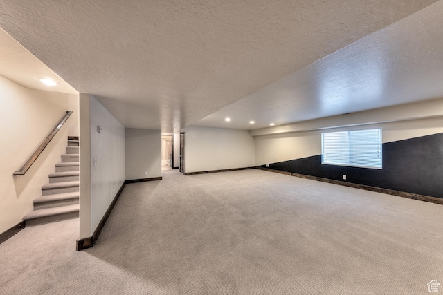 284 W Mcgill Blvd, Moab, UT 84532 - basement with baseboards, a textured ceiling, carpet floors, recessed lighting, and stairs