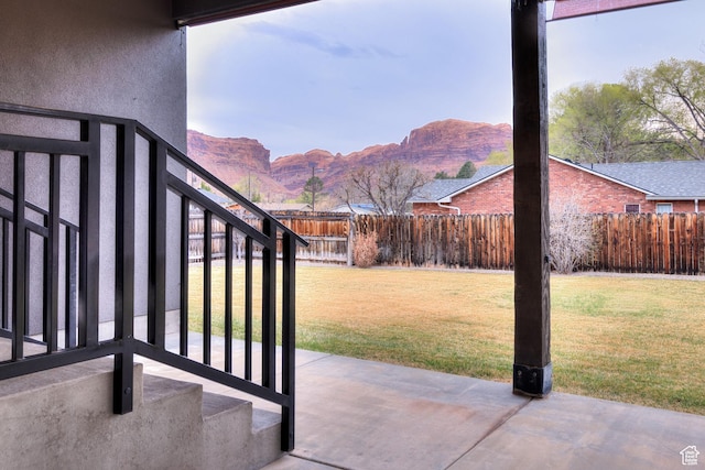 284 W Mcgill Blvd, Moab, UT 84532 - view of patio featuring a mountain view, a fenced backyard, and stairway