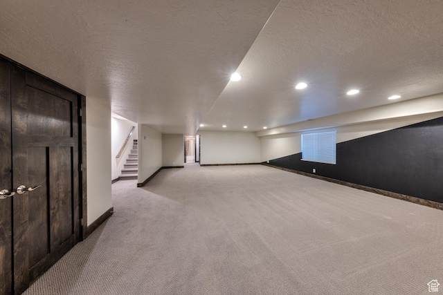 284 W Mcgill Blvd, Moab, UT 84532 - additional living space featuring a textured ceiling, light carpet, and stairs
