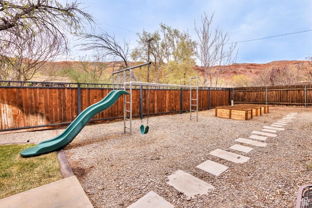 284 W Mcgill Blvd, Moab, UT 84532 - view of jungle gym with a garden and fence