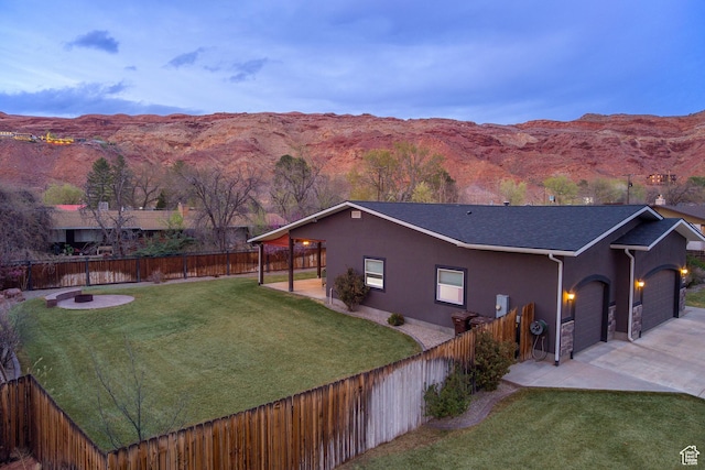 284 W Mcgill Blvd, Moab, UT 84532 - exterior space featuring a mountain view, a lawn, and stucco siding