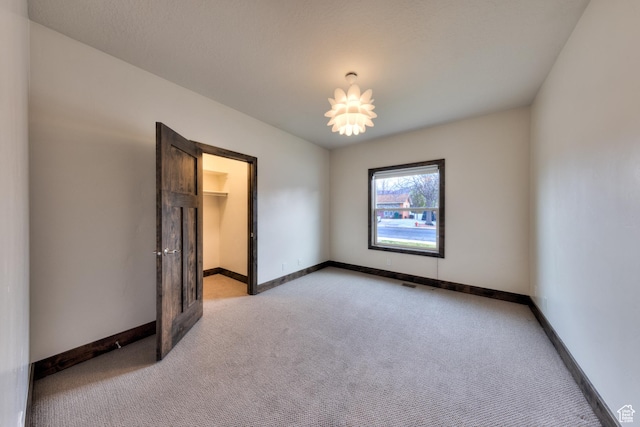 284 W Mcgill Blvd, Moab, UT 84532 - empty room featuring light carpet, baseboards, and visible vents