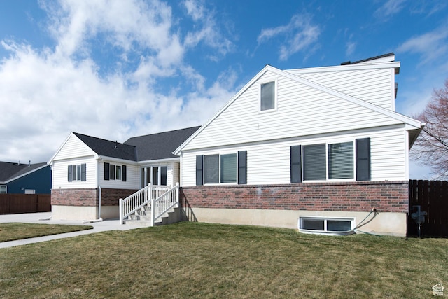 485 N 400 W, Tremonton, UT 84337 - view of front facade featuring a front yard, fence, and brick siding