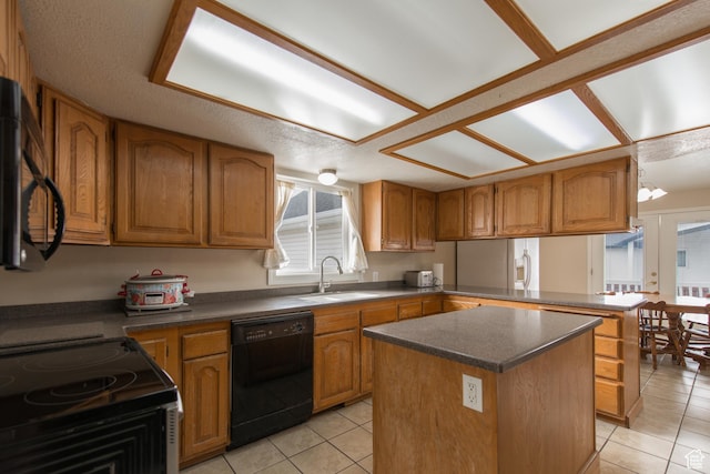 485 N 400 W, Tremonton, UT 84337 - kitchen with light tile patterned floors, a center island, black dishwasher, a sink, and brown cabinets