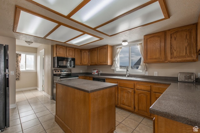 485 N 400 W, Tremonton, UT 84337 - kitchen featuring black microwave, light tile patterned floors, electric range, dark countertops, and a sink