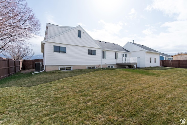 485 N 400 W, Tremonton, UT 84337 - rear view of house featuring a yard, a fenced backyard, and central AC