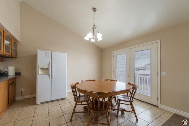 485 N 400 W, Tremonton, UT 84337 - dining area with baseboards, light tile patterned floors, a notable chandelier, and vaulted ceiling