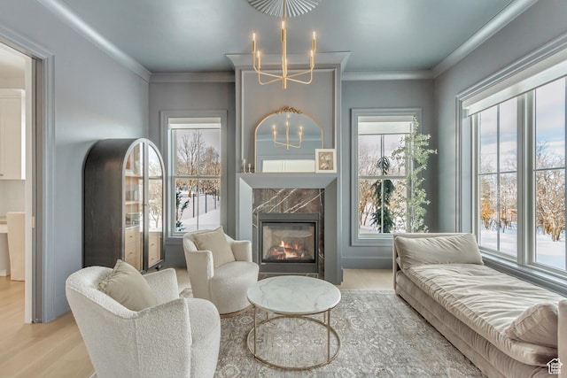 70 E Deer Meadow Ct, Woodland Hills, UT 84653 - living area with a healthy amount of sunlight, wood finished floors, a chandelier, and a premium fireplace