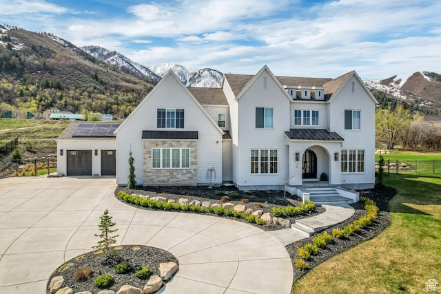 70 E Deer Meadow Ct, Woodland Hills, UT 84653 - modern farmhouse style home with a mountain view, driveway, fence, metal roof, and an attached garage
