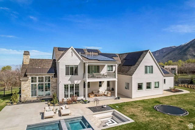 70 E Deer Meadow Ct, Woodland Hills, UT 84653 - rear view of house featuring a fenced in pool, a balcony, a patio, an outdoor living space, and a lawn