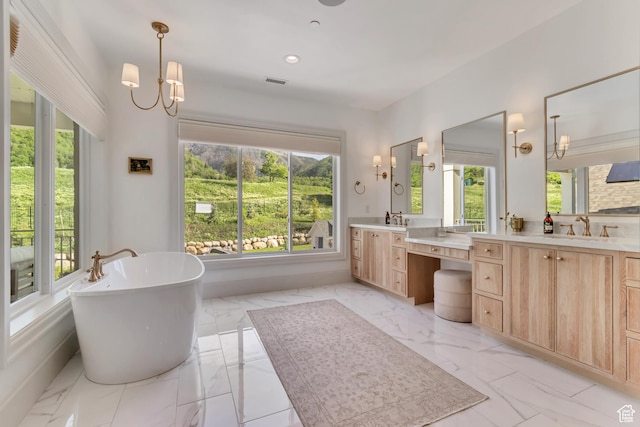 70 E Deer Meadow Ct, Woodland Hills, UT 84653 - bathroom with marble finish floors, a freestanding bath, vanity, and recessed lighting