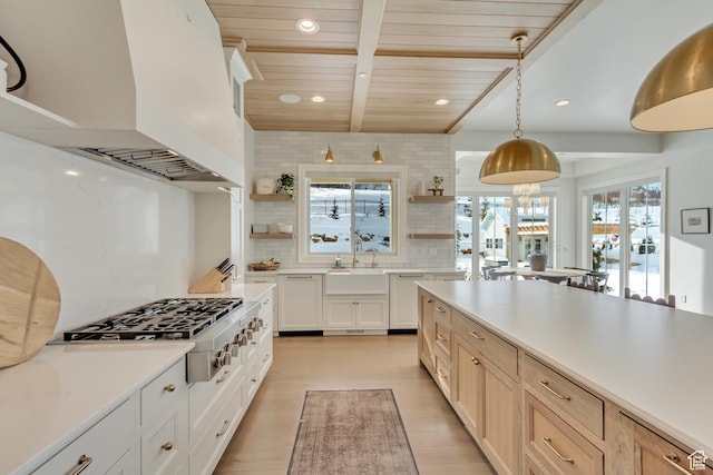 70 E Deer Meadow Ct, Woodland Hills, UT 84653 - kitchen featuring wall chimney exhaust hood, a sink, backsplash, stainless steel gas stovetop, and open shelves