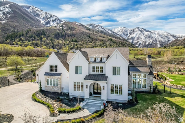 70 E Deer Meadow Ct, Woodland Hills, UT 84653 - rear view of house featuring a standing seam roof, fence, a mountain view, and metal roof