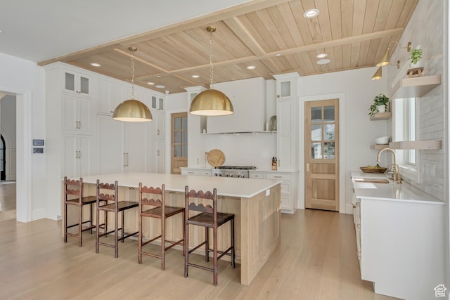 70 E Deer Meadow Ct, Woodland Hills, UT 84653 - kitchen featuring open shelves, a sink, light wood finished floors, light countertops, and wooden ceiling
