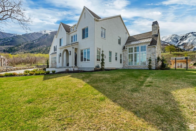 70 E Deer Meadow Ct, Woodland Hills, UT 84653 - back of house featuring fence, a chimney, a yard, and a mountain view