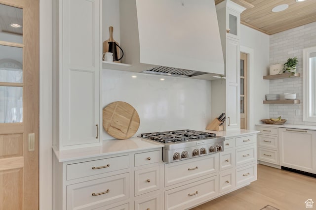 70 E Deer Meadow Ct, Woodland Hills, UT 84653 - kitchen featuring stainless steel gas stovetop, open shelves, decorative backsplash, custom exhaust hood, and white cabinetry