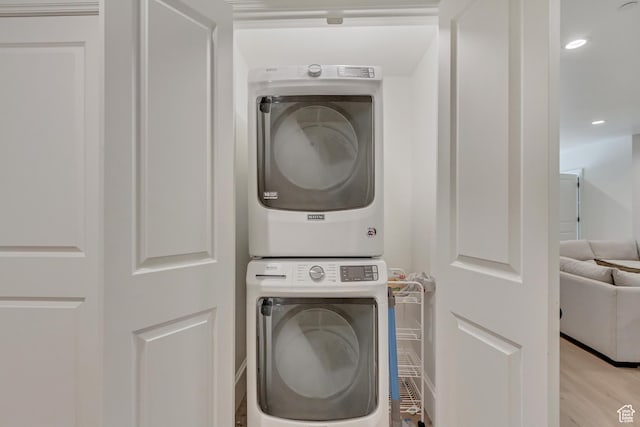 70 E Deer Meadow Ct, Woodland Hills, UT 84653 - clothes washing area with recessed lighting, light wood-style flooring, stacked washing maching and dryer, and laundry area