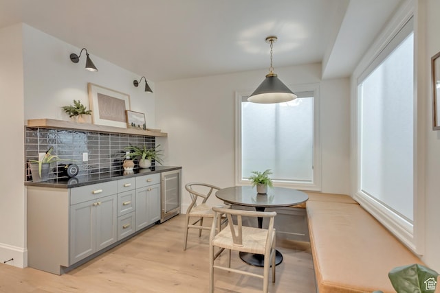 70 E Deer Meadow Ct, Woodland Hills, UT 84653 - dining space with a bar, wine cooler, and light wood-style floors