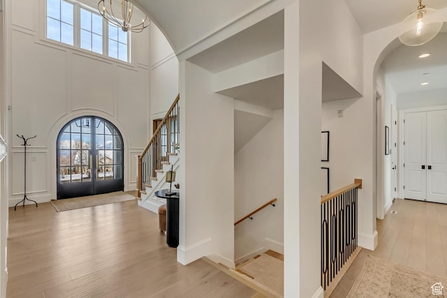 70 E Deer Meadow Ct, Woodland Hills, UT 84653 - foyer entrance with recessed lighting, arched walkways, wood finished floors, and an inviting chandelier