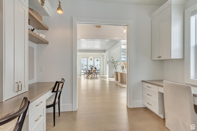70 E Deer Meadow Ct, Woodland Hills, UT 84653 - office area featuring built in study area, light wood finished floors, and baseboards