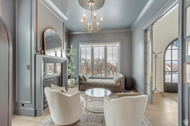 70 E Deer Meadow Ct, Woodland Hills, UT 84653 - sitting room with light wood-style flooring, ornamental molding, and an inviting chandelier