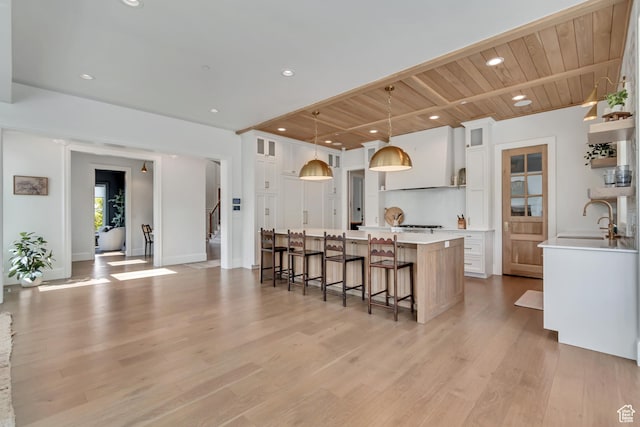 70 E Deer Meadow Ct, Woodland Hills, UT 84653 - kitchen featuring a sink, light countertops, a spacious island, white cabinets, and recessed lighting