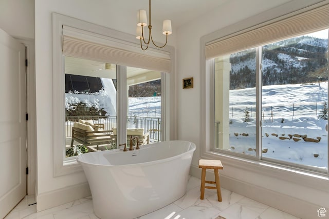 70 E Deer Meadow Ct, Woodland Hills, UT 84653 - full bath with marble finish floor, a wealth of natural light, a freestanding tub, and baseboards