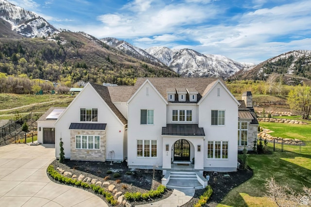 70 E Deer Meadow Ct, Woodland Hills, UT 84653 - view of front of property featuring driveway, fence, a mountain view, metal roof, and a standing seam roof