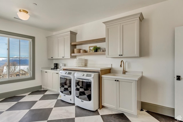 70 E Deer Meadow Ct, Woodland Hills, UT 84653 - laundry area with visible vents, a sink, washing machine and dryer, baseboards, and cabinet space
