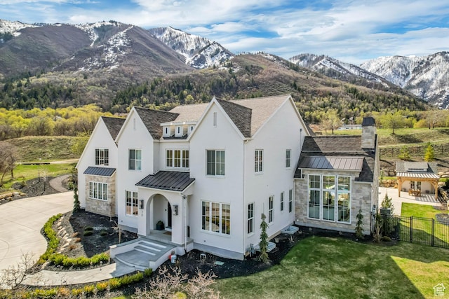 70 E Deer Meadow Ct, Woodland Hills, UT 84653 - view of front of property with metal roof, fence, a front yard, stucco siding, and a standing seam roof