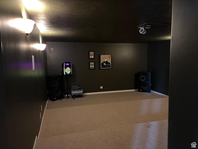 interior space with baseboards and a textured ceiling
