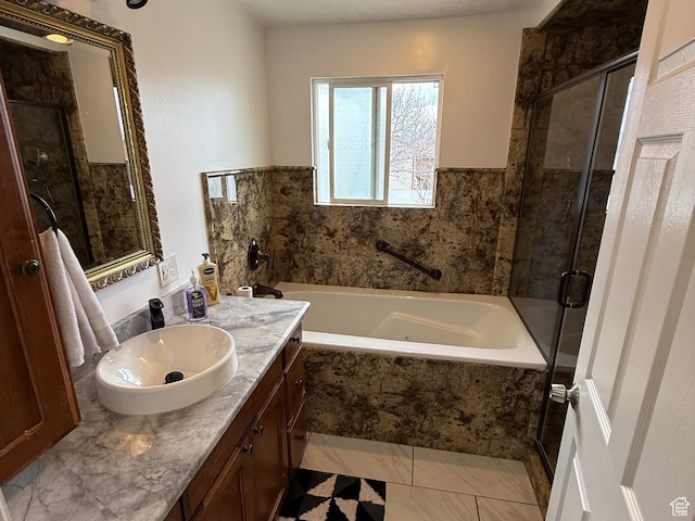 full bathroom with a shower stall, vanity, marble finish floor, and a tub with jets
