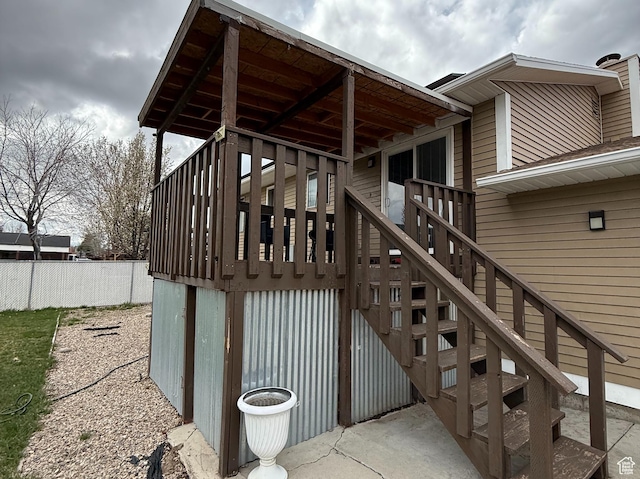 exterior space featuring fence and stairs
