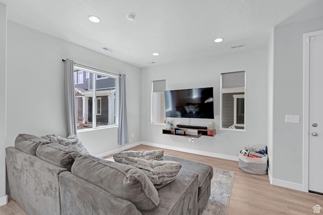 3219 W 3825 S, West Haven, UT 84401 - living area featuring visible vents, baseboards, recessed lighting, and wood finished floors