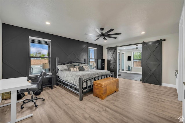 444 S 1530 W, Hurricane, UT 84737 - bedroom with light wood-style flooring, baseboards, multiple windows, and a barn door