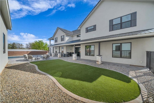 444 S 1530 W, Hurricane, UT 84737 - rear view of property with a patio, metal roof, stucco siding, and fence