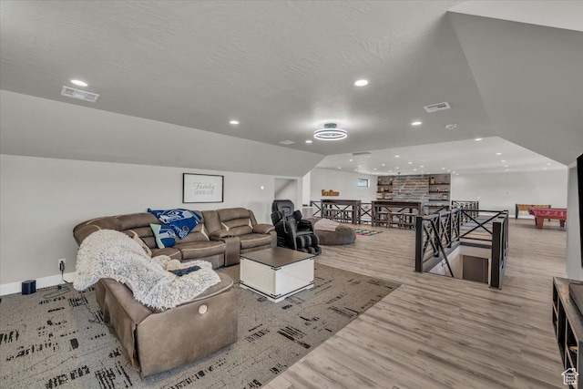 444 S 1530 W, Hurricane, UT 84737 - living room featuring lofted ceiling, visible vents, a textured ceiling, and wood finished floors