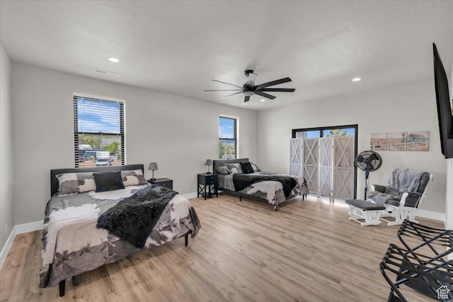 444 S 1530 W, Hurricane, UT 84737 - bedroom with light wood-type flooring, ceiling fan, baseboards, and multiple windows