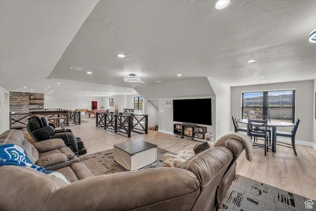 444 S 1530 W, Hurricane, UT 84737 - living room featuring a wealth of natural light, light wood-style flooring, and a textured ceiling