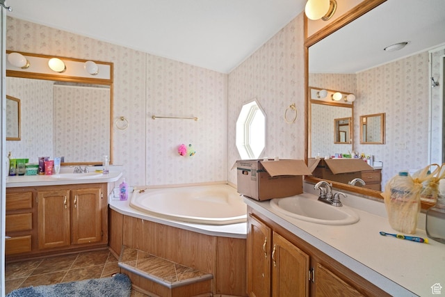5801 S 7100 W, Hooper, UT 84315 - full bathroom featuring two vanities, a bath, tile patterned flooring, a sink, and wallpapered walls