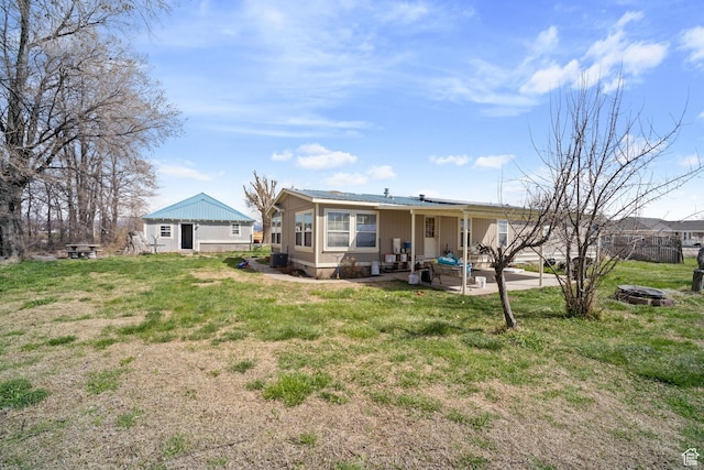 5801 S 7100 W, Hooper, UT 84315 - rear view of property featuring a patio, fence, and a lawn