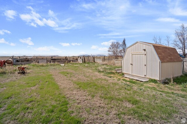 5801 S 7100 W, Hooper, UT 84315 - view of yard featuring an outdoor structure, fence, and a shed