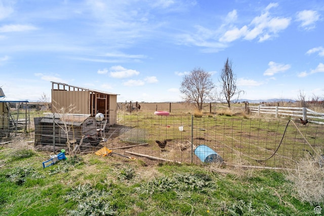 5801 S 7100 W, Hooper, UT 84315 - view of yard with an outbuilding, fence, and a rural view