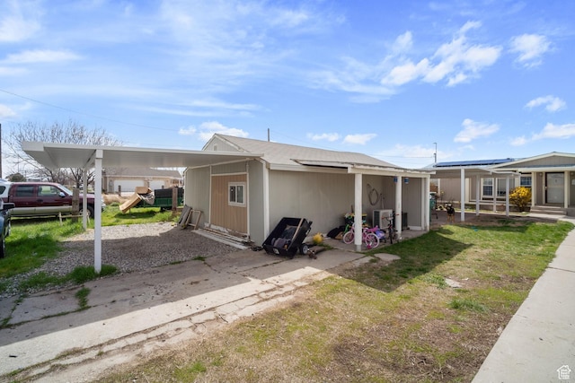5801 S 7100 W, Hooper, UT 84315 - view of front of property featuring a patio area, central AC unit, an attached carport, and gravel driveway