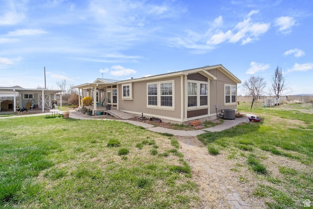 5801 S 7100 W, Hooper, UT 84315 - back of property with a lawn and central air condition unit