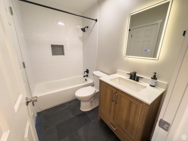 bathroom featuring toilet, vanity, and shower / washtub combination