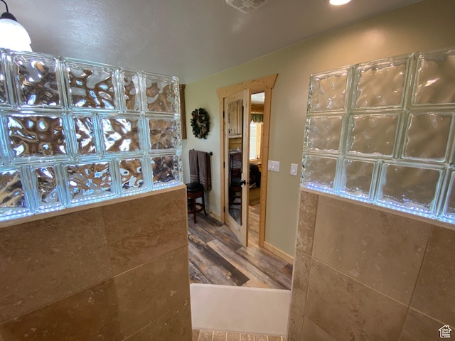 interior space featuring wood finished floors and visible vents